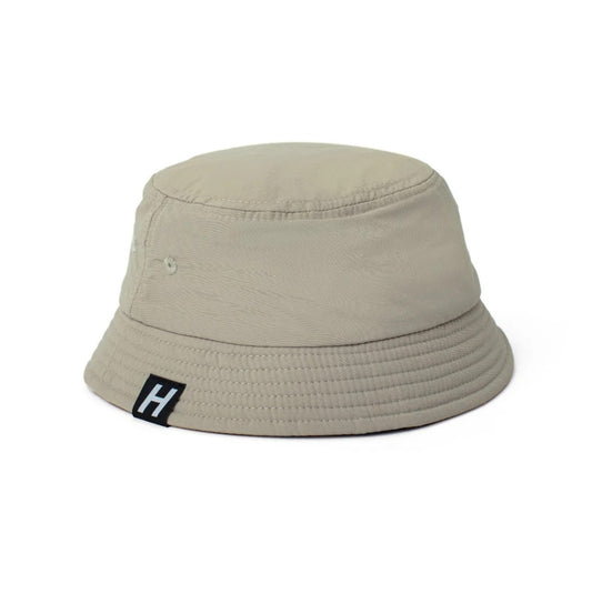 A beige waterproof bucket hat with a break-away clip and a reinforced brim, designed for children.